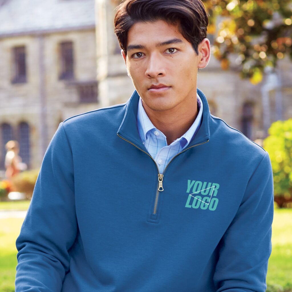 young man on a college campus wearing a custom embroidered polo